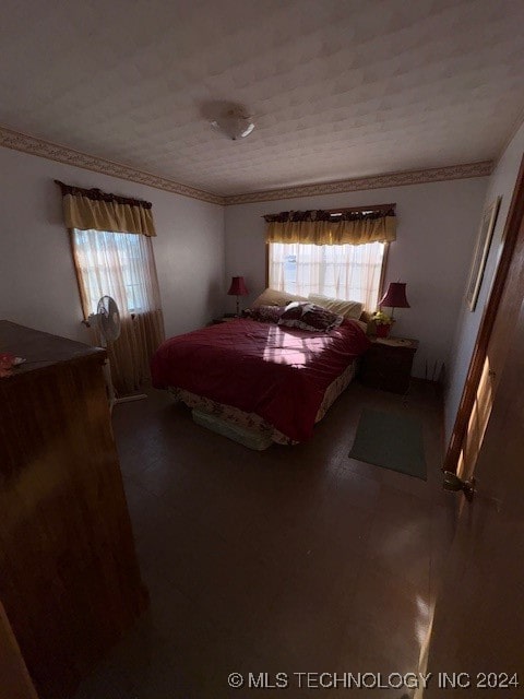 bedroom featuring crown molding