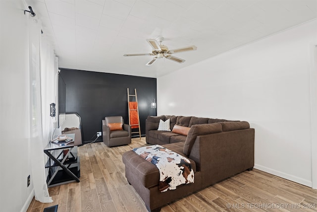 living room with ceiling fan and hardwood / wood-style flooring