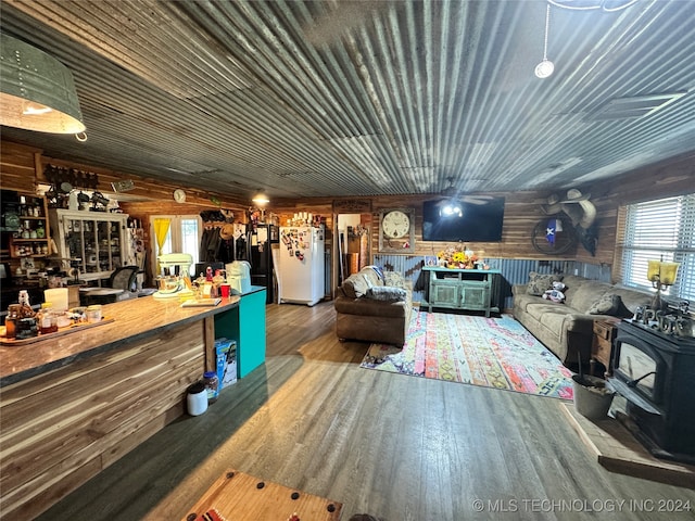 interior space featuring hardwood / wood-style flooring and wooden walls