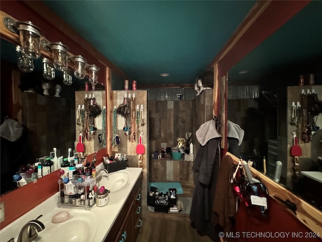 bathroom featuring vanity and hardwood / wood-style floors