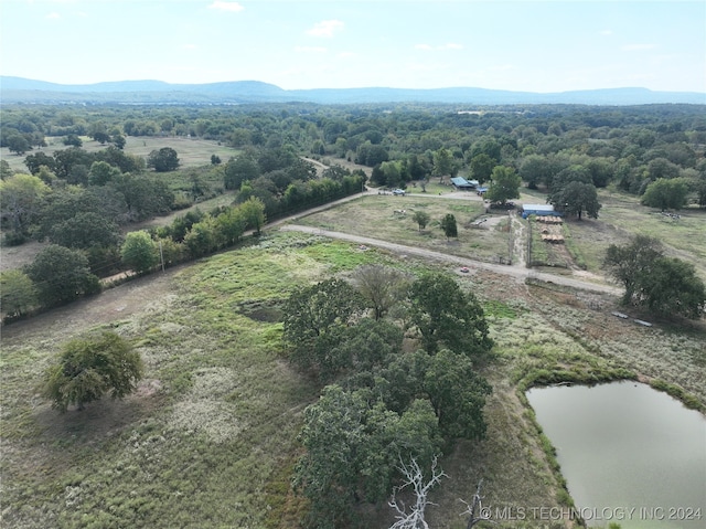 drone / aerial view with a rural view and a water and mountain view