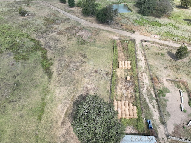 bird's eye view with a rural view and a water view