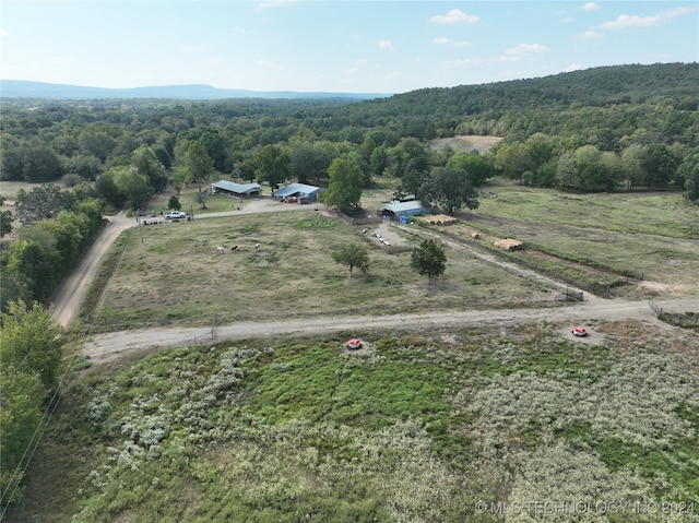 birds eye view of property with a rural view