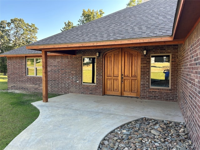 entrance to property with a patio