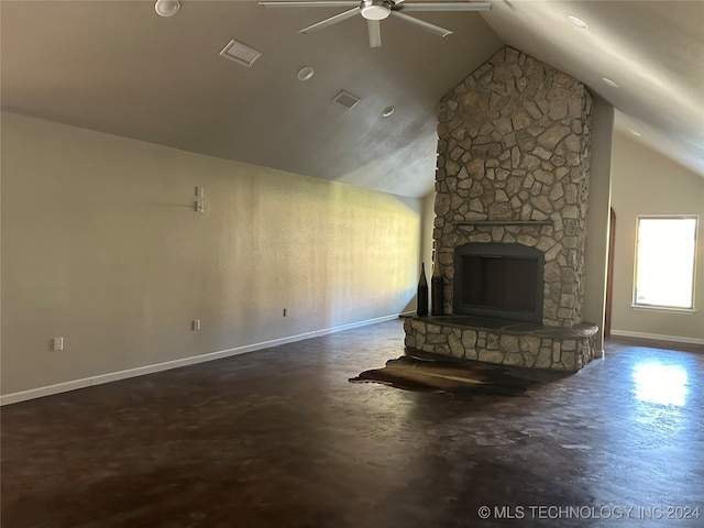 unfurnished living room with ceiling fan, a stone fireplace, and lofted ceiling