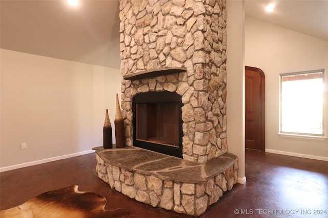 details featuring hardwood / wood-style flooring and a stone fireplace