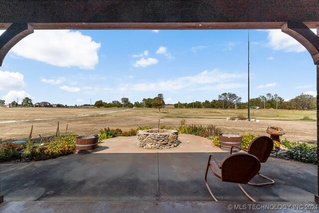 view of patio with a rural view