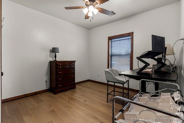 office space with ceiling fan and light hardwood / wood-style floors