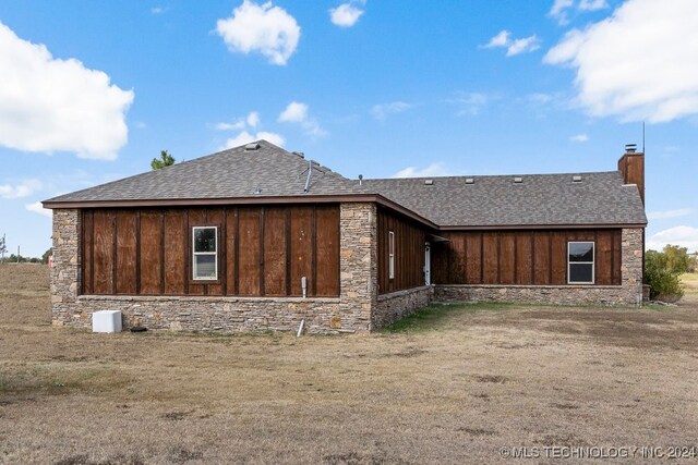 view of property exterior with a lawn