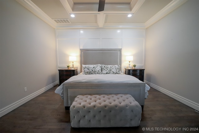 bedroom with coffered ceiling, crown molding, and dark wood-type flooring