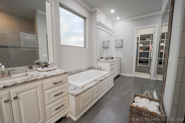 bathroom with ornamental molding, vanity, and plus walk in shower