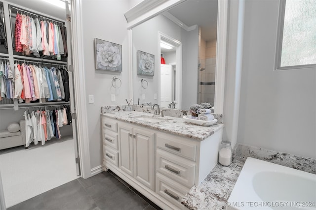 bathroom with ornamental molding, vanity, and shower with separate bathtub