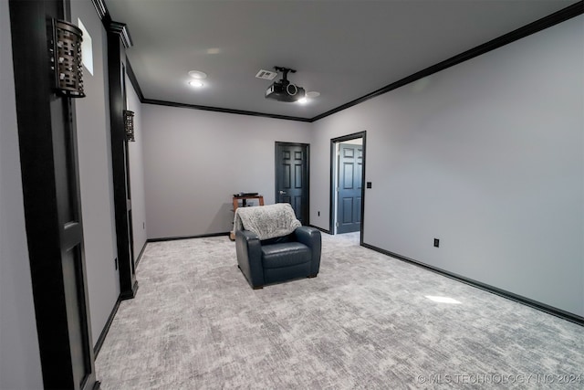 living area featuring light carpet and ornamental molding