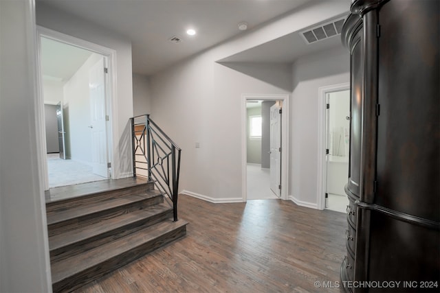 stairs with hardwood / wood-style floors