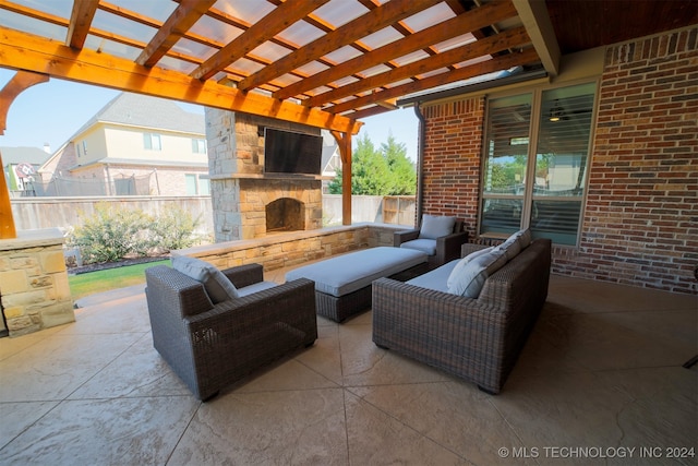 view of patio / terrace featuring an outdoor living space with a fireplace and a pergola