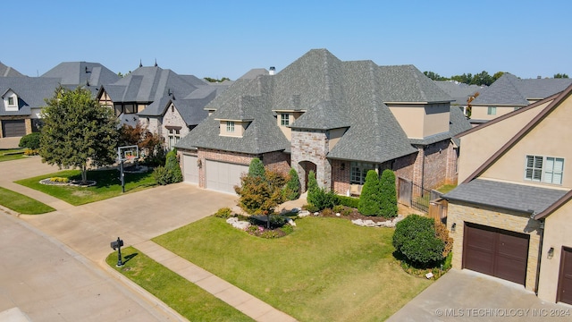 view of front of home featuring a garage and a front lawn