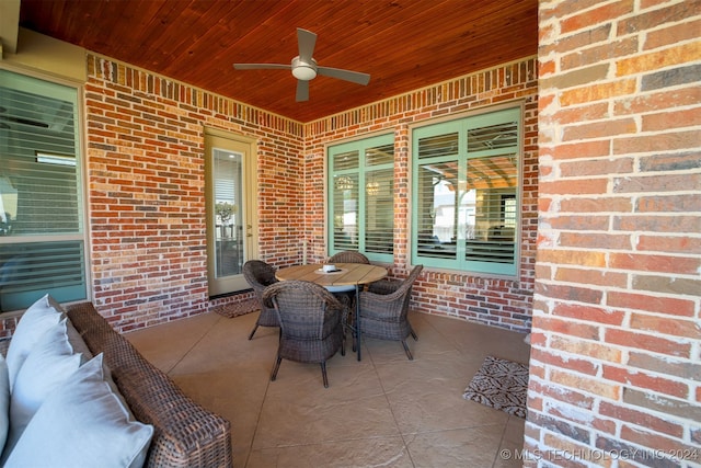 view of patio featuring ceiling fan