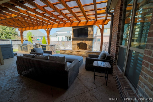 view of patio / terrace featuring an outdoor living space with a fireplace, a pergola, and area for grilling