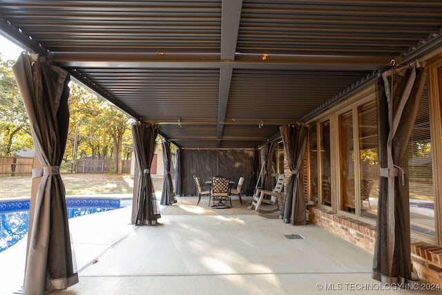 exterior space with a fenced in pool