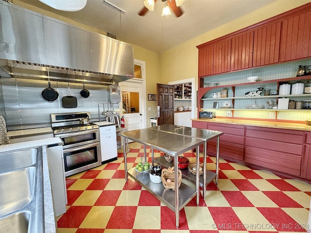 kitchen featuring ceiling fan, double oven range, butcher block counters, sink, and range hood