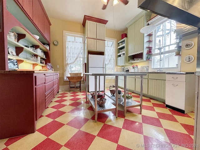 kitchen with white fridge and ceiling fan