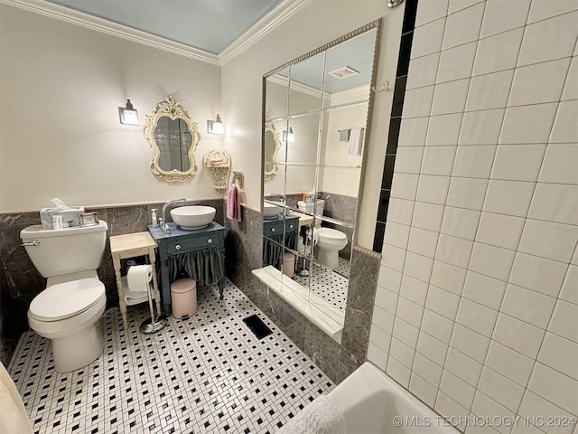 full bathroom featuring vanity, tile walls, tile patterned floors, ornamental molding, and toilet