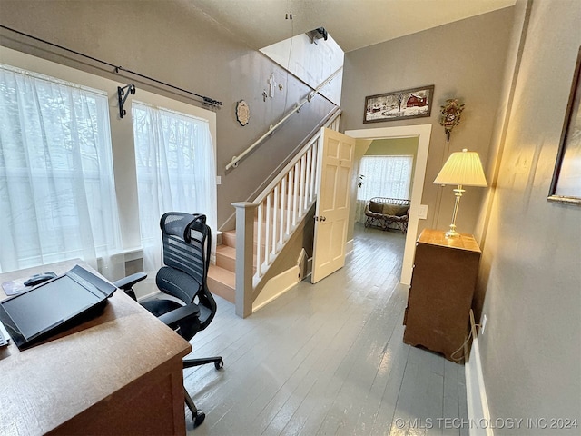 office space with a healthy amount of sunlight and hardwood / wood-style floors