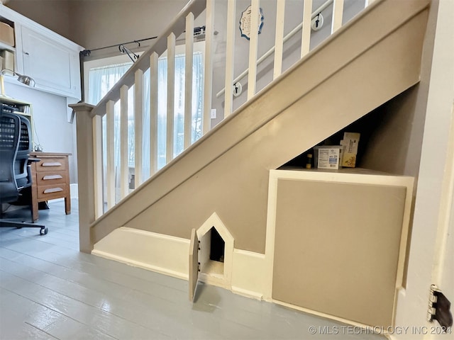 stairway with wood-type flooring