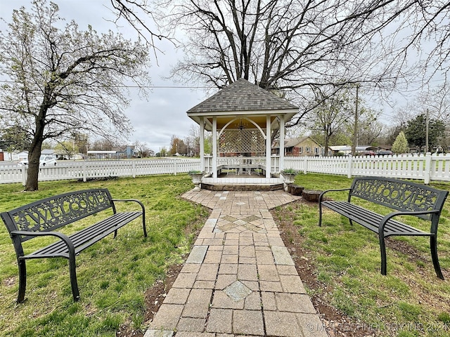 surrounding community featuring a gazebo and a lawn