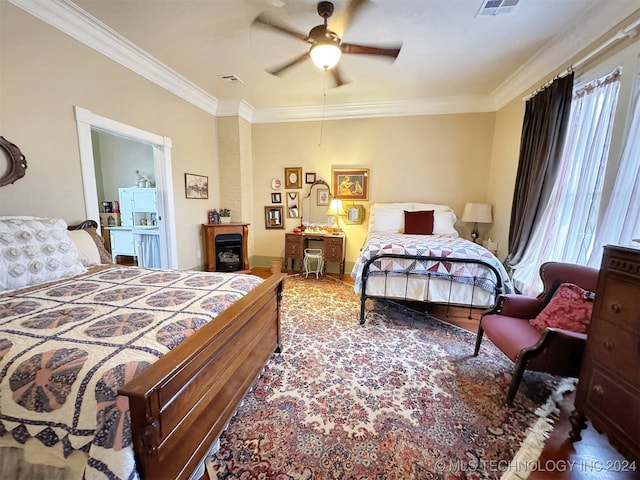 bedroom featuring multiple windows, ceiling fan, and crown molding