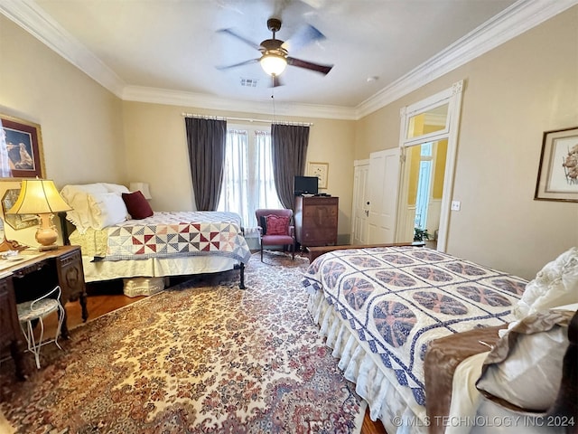 bedroom featuring ornamental molding, ceiling fan, and wood-type flooring