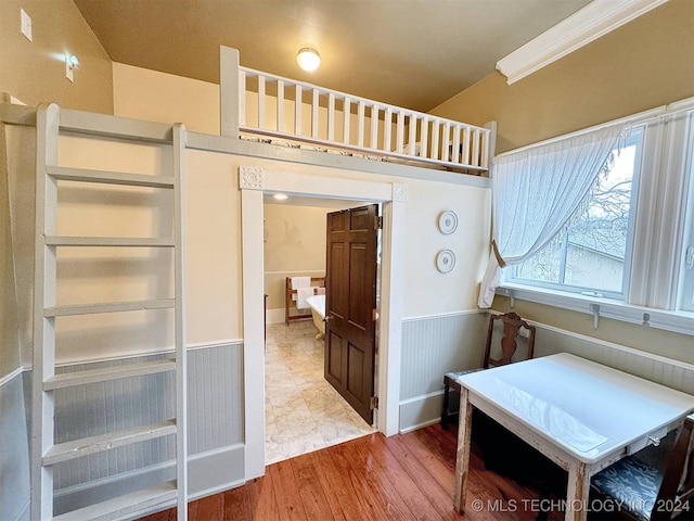 bedroom with hardwood / wood-style flooring