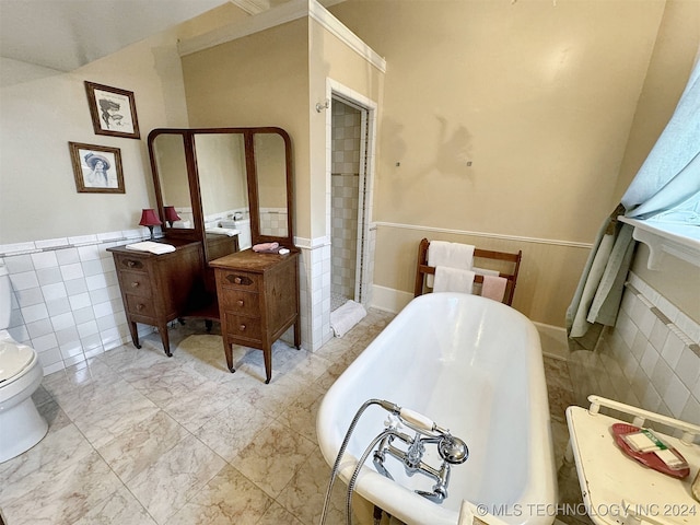 bathroom with shower with separate bathtub, tile walls, and toilet