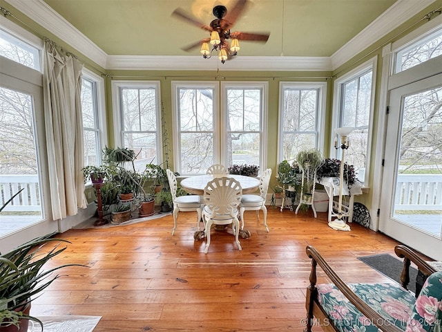 sunroom / solarium with ceiling fan and plenty of natural light