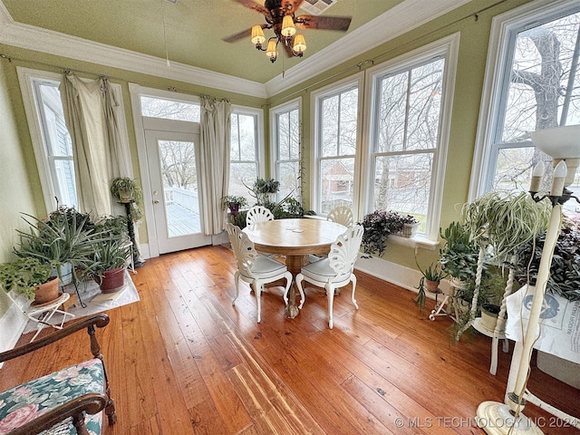 sunroom / solarium with ceiling fan