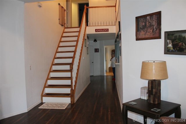 stairs featuring hardwood / wood-style flooring