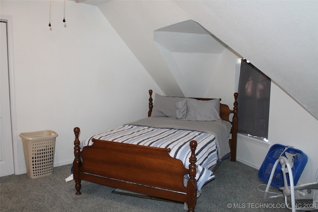 bedroom featuring carpet floors and lofted ceiling