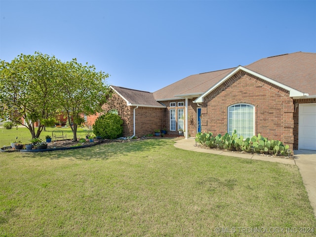 ranch-style house with a front yard and a garage