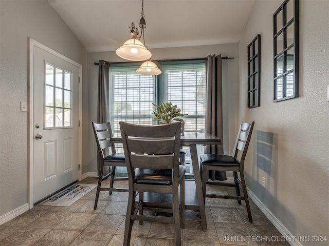 dining space with lofted ceiling and plenty of natural light