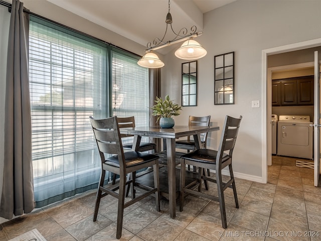 dining room with independent washer and dryer