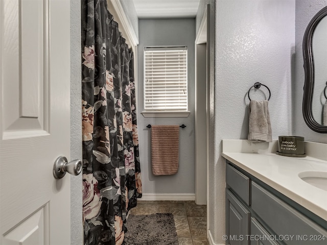 bathroom with tile patterned floors and vanity