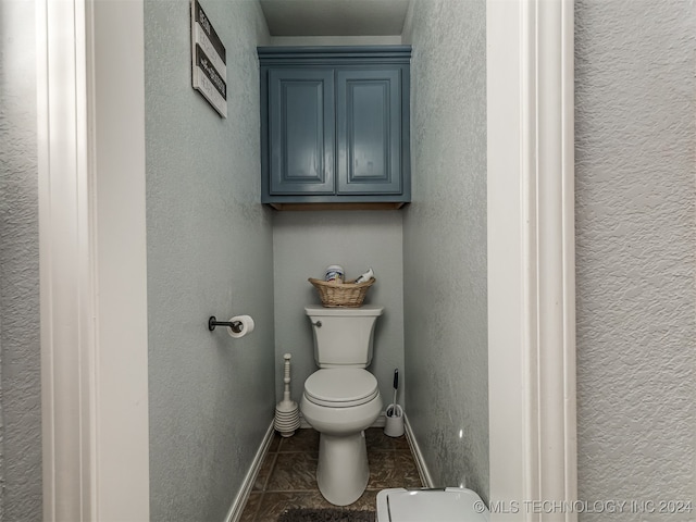 bathroom featuring tile patterned flooring and toilet