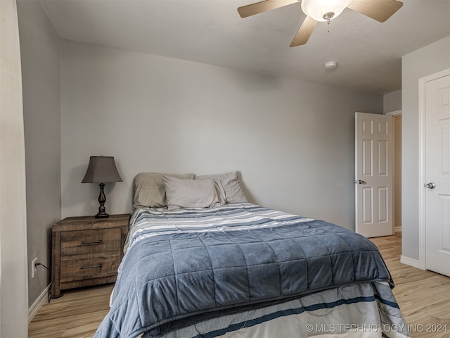 bedroom featuring ceiling fan and light hardwood / wood-style floors