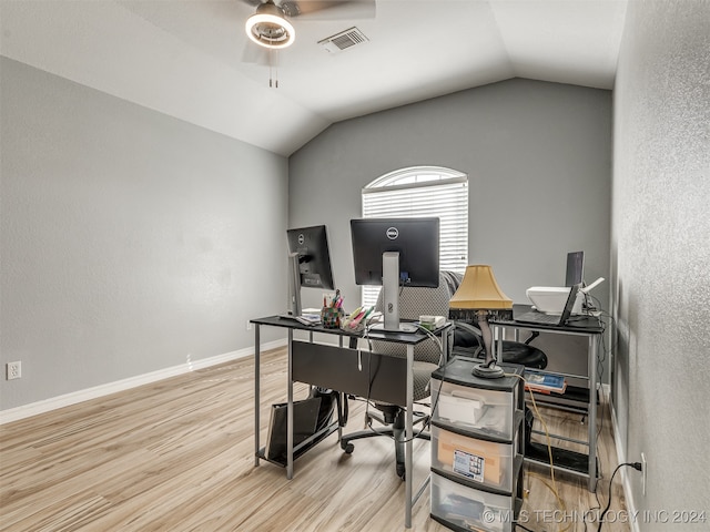 office space with ceiling fan, light hardwood / wood-style flooring, and lofted ceiling