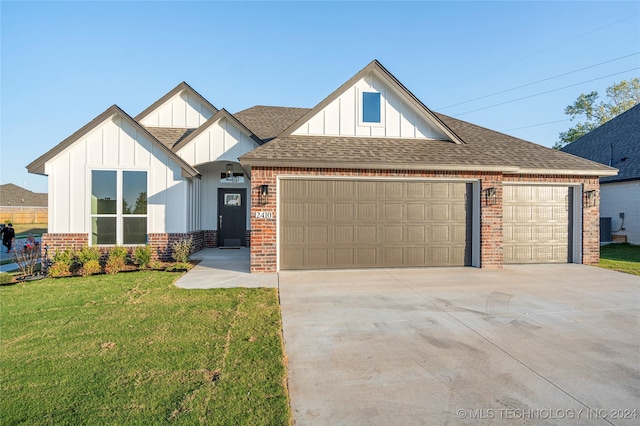 view of front of property featuring a garage and a front yard