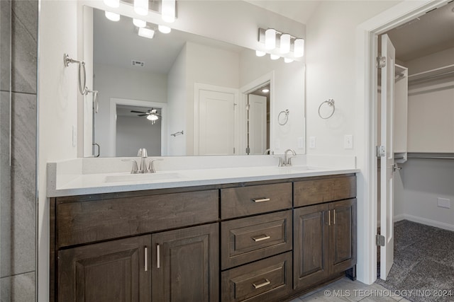 bathroom featuring ceiling fan and vanity