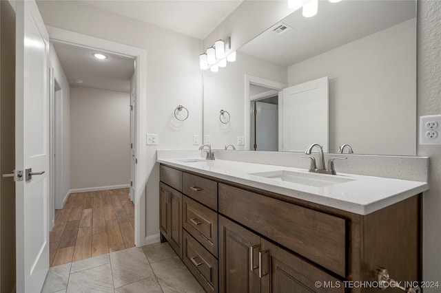 bathroom with vanity and hardwood / wood-style floors