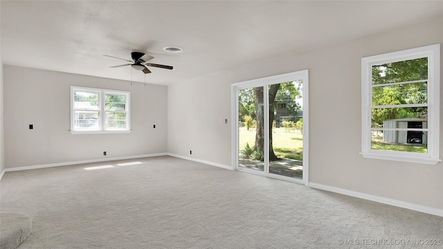 711 NW Elizabeth St, Ardmore, OK 73401 - spare room with ceiling fan, carpet, and plenty of natural light