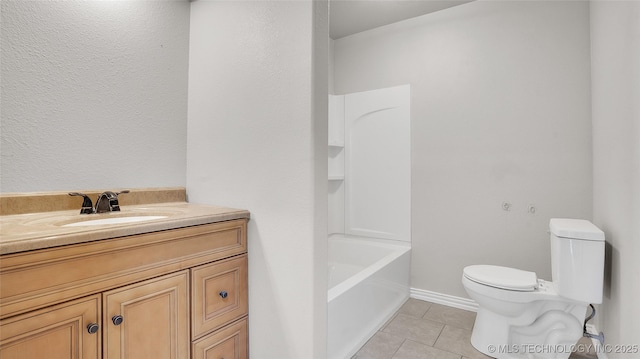711 NW Elizabeth St, Ardmore, OK 73401 - bathroom featuring tile patterned flooring, vanity, and toilet
