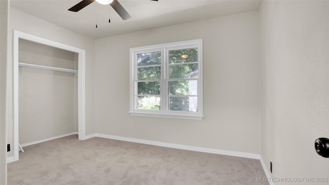 711 NW Elizabeth St, Ardmore, OK 73401 - unfurnished bedroom featuring a closet, ceiling fan, and light carpet